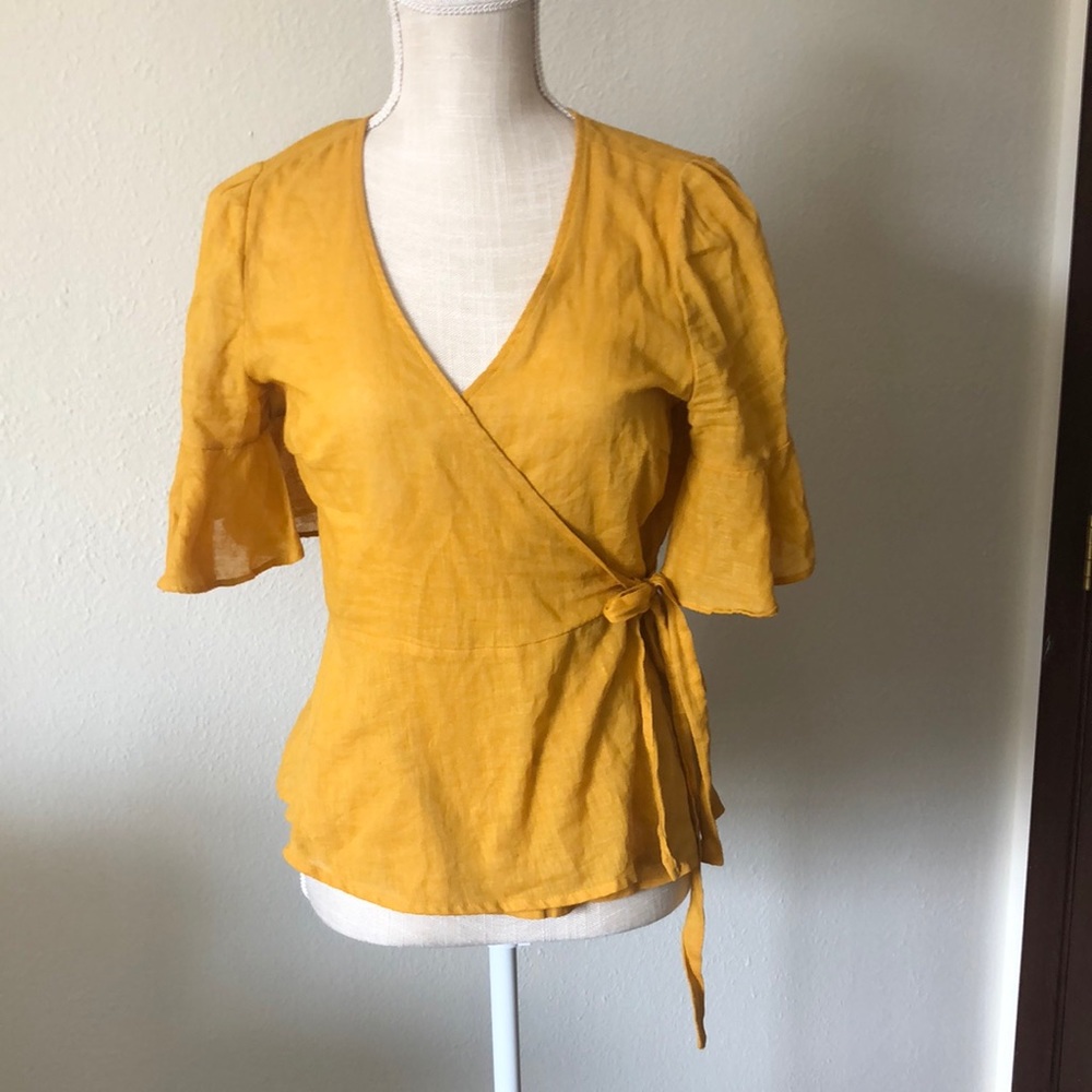 Cute yellow linen like material short sleeve wrap around blouse.
